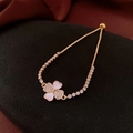 Detailed view of 18k gold plated clover bracelet with mother of pearl on black texture - Gold - Shell Diamond Clover Adjustable