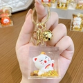 Golden liquid glitter Maneki Neko keychain in square acrylic case with bell - Lucky Cat Family - Red Envelope / Individual Packaging