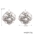 Pendientes vintage trenzados de plata con perlas de concha brillantes y diseño calado único - Color Acero
