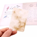 Beige marble pattern jewelry display card for necklaces and earrings held in hand - Marble No.1