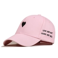 Pink canvas baseball cap with black heart embroidery and love quotes on pure background - White