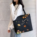 Large black canvas tote bag with Autumn Harvest hedgehog print for women on shoulder - Autumn Leaves / Black