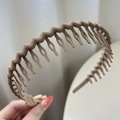 Matte khaki wavy hair hoop with non-slip fine teeth and hollow droplet design for women - Coffee
