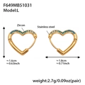 Detail of heart-shaped gold-plated stainless steel earrings with blue zircon inlays - Large Dark Blue Zirconia Earrings