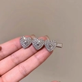 Silver hair clip featuring three heart elements with sparkling crystals and metal center - Silver Triple Heart