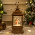 Vintage bronze Christmas lantern music box with snowman scene and swirling glitter - Snowman