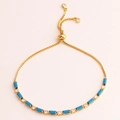 Detail of gold bracelet with turquoise baguette stones and an adjustable sliding clasp - Peacock Blue Adjustable Bracelet