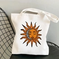 White canvas tote bag with sun and moon art print on a black wire mesh chair - STD438-E (Anthropomorphic Colorful Sun Moon)