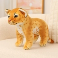 Realistic stuffed leopard plush toy with brown spots in a standing pose on a sofa - Leopard / 26cm