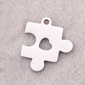 Silver puzzle piece pendant with heart cutout in mirror polished stainless steel - Puzzle Heart / Steel