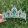 Macro detail of luxury bridal crown with green crystals and silver alloy frame - Silver + Green Zirconia