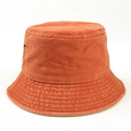 Detail view of stitched canvas texture on a vintage orange washed cotton bucket hat - M (56-58cm) / Orange Red