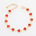 Close-up of gold-plated bracelet featuring red heart glass stones and lobster clasp - Bracelet 17+5cm / Gold+Red