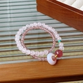 Detailed macro of white crystal bracelet with peaceful buckle and pink beads - Rose Quartz Safety Buckle Layered Style (36#)