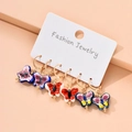 Three pairs of golden hoop earrings featuring colorful enamel butterfly ceramic pendants - 3 Pairs Butterfly Set