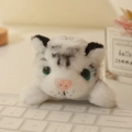 Peluche tigre bianca magnetica con strisce nere appoggiata su una tastiera da ufficio - 12cm / Tigre Bianca