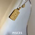 Golden stainless steel rectangular pendant necklace featuring Pisces zodiac engraving - Pisces