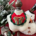 Detail of red and green hand-knitted pet Christmas bib with gift box patch for small pets - One Size / Christmas Gift