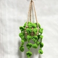 Handmade crochet hanging plant with green heart leaves and beige woven basket - Green + Khaki Hanging Style