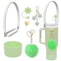 Detail of green Stanley cup accessory set with floral straw cover and plush pompom pendant - Green