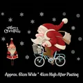 Christmas Santa Claus on bicycle wall sticker set with white snowflakes 61x41cm - Santa Riding Bicycle / Medium