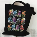 Black canvas tote bag featuring vibrant floral and butterfly prints with shoulder straps - Flower and Butterfly (Black)