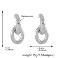 Silver geometric stainless steel drop earrings with chunky twisted ring design - Silver/Steel Style F491