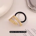 Minimalist gold metal hair tie with textured hammered finish and black elastic band - Irregular Square Hollow Gold