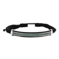 Macro detail of men's woven bracelet with green zircon micro-pave setting on black metal - Silver Woven Green Zircon Curved Tube Bracelet