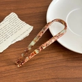 Minimalistische U-vormige haarspeld van acetaat met bruin schildpadpatroon - Koffiegroen