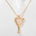Golden heart mirror necklace with red rose relief on a snake chain displayed on mannequin - Gold