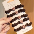 Set of 5 dark brown hair ties with resin heart charms on a stylish display card - Dark Coffee Heart Decor 5Pcs Set