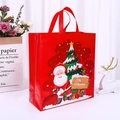 Red non-woven Christmas gift bag with Santa Claus and Feliz Navidad greeting print - Christmas Red Large
