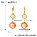 Elegant gold stainless steel drop earrings with clear and orange-pink Czech glass stones - Gold Champagne Glass