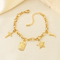 Detail of gold-tone cross, star, and moon charms on a stainless steel O-chain bracelet - Cross Star Moon Style (KB204108-SXSJ)