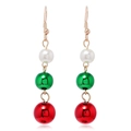 Detail of festive Christmas earrings with white faux pearl, green and red metallic spheres - Blue Truck