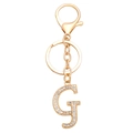 Detail van een gouden alfabet letter G sleutelhanger met strassteentjes en sluiting - Letter G