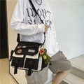 Large black and white messenger bag with badges and dinosaur charm in casual style - Random Badges + Dinosaur Pendant / Black and White