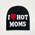 Detailed knit texture of a black beanie featuring a white I HOT MOMS jacquard design - Moms Style / Black