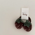 Pair of knitted strawberry hair ties with brown base and green leaves on white card - Brown Strawberry
