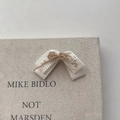 Elegant ivory bow hair claw clip with lace and pearl beads on a textured surface - Beige Three-Layer Bow
