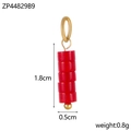 Detailed macro view of 1.8cm red bead pendant with gold ring and small decorative metal ball - Red