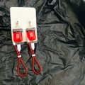 Detailed close-up of a Blood Group B drip bag earring on a black textured background - Type B Stud Earrings