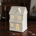 White ceramic Christmas house ornament with warm light LED, dimensions 14x9x7.7cm - Model B - House
