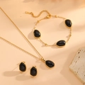 Golden stainless steel jewelry set featuring oval black cat eye pendants and earrings - Black Jewelry Set (A520-A618-A620)