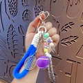 Portachiavi da tennis con anello di peluche blu e perline colorate per borse - Viola
