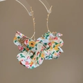 Close-up of golden branch earrings with colorful floral tassels and pearl accents - Silver Earring Post - Gold Style / Green
