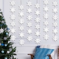 White snowflake garland hanging decorations on a festive Christmas tree background - 6 Strings