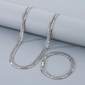 Conjunto de collar y pulsera de cadena cubana plateada en acero con brillo metálico - Conjunto Color Acero 7mm