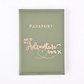 Close-up of sage green PU leather passport cover with rose gold adventure engraving - Avocado Green